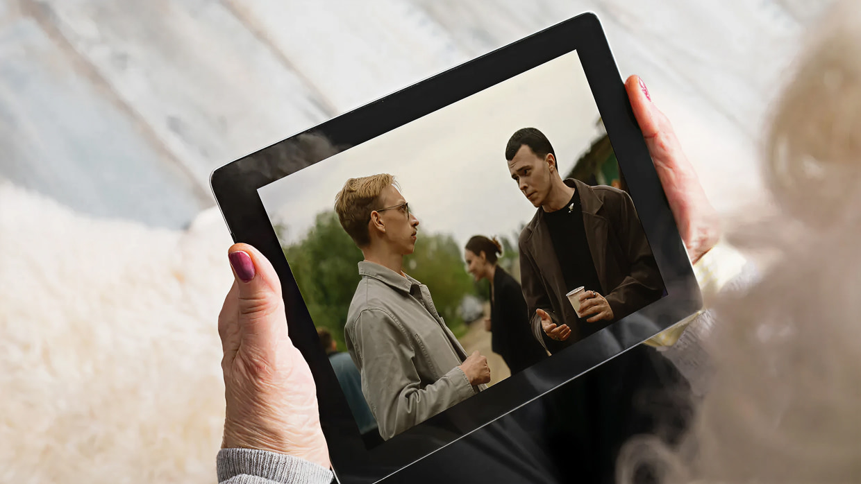 mature woman watch tablet